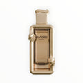 Rimaal Jasmere French Avenue Parfum in einem eleganten, goldfarbenen Flakon mit kunstvollem Reliefdesign.